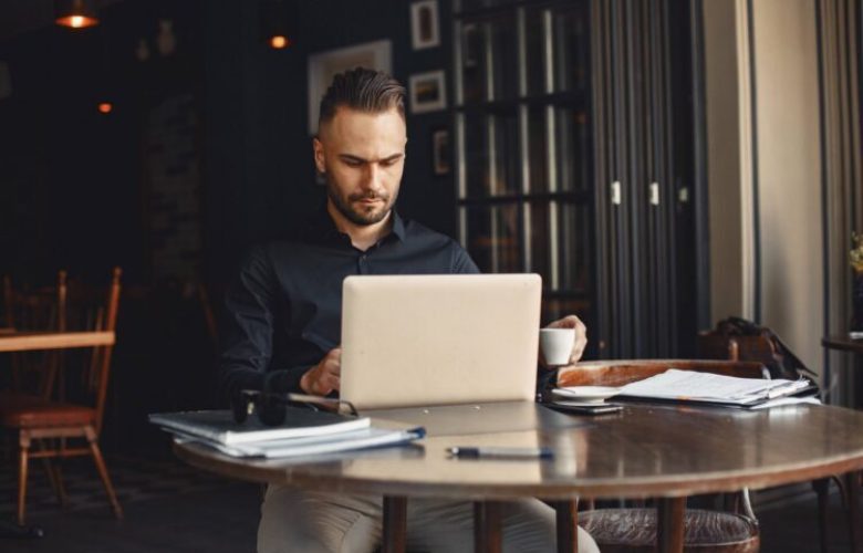 man-drinks-coffe-businessman-reads-documents-director-shirt (1)